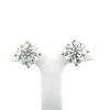 A pair of lab diamond studs set in 14Kt gold, with one earring in yellow gold and the other in white gold, displayed on a white mount.