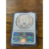 Silver coin in a protective case on a wooden surface