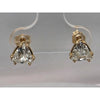 1.5ctw natural diamonds trillion studs in double prong studs in 14kt gold mounts.