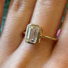 2 Ctw Lab Emerald Cut Bezel Set Diamond Ring is 14Kt Yellow Gold