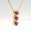 1ctw natural ruby pendant in 14kt yellow gold on 18in box chain.